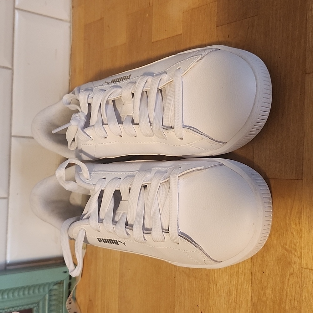 Puma, size 8.5 white sneakers with iridescent stripes on sides.